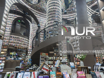 Visitors read books at Zhongshuge Bookstore in Chengdu, China, on October 13, 2024. (