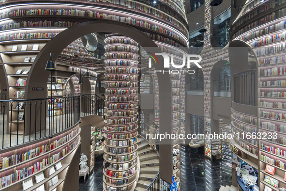 Visitors read books at Zhongshuge Bookstore in Chengdu, China, on October 13, 2024. 