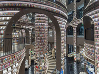 Visitors read books at Zhongshuge Bookstore in Chengdu, China, on October 13, 2024. (