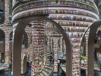 Visitors read books at Zhongshuge Bookstore in Chengdu, China, on October 13, 2024. (