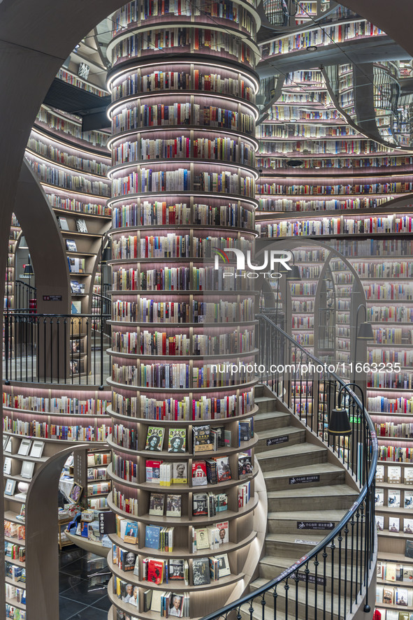 Visitors read books at Zhongshuge Bookstore in Chengdu, China, on October 13, 2024. 