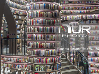 Visitors read books at Zhongshuge Bookstore in Chengdu, China, on October 13, 2024. (