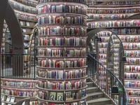 Visitors read books at Zhongshuge Bookstore in Chengdu, China, on October 13, 2024. (