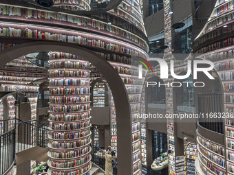 Visitors read books at Zhongshuge Bookstore in Chengdu, China, on October 13, 2024. (