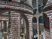 Visitors read books at Zhongshuge Bookstore in Chengdu, China, on October 13, 2024. (