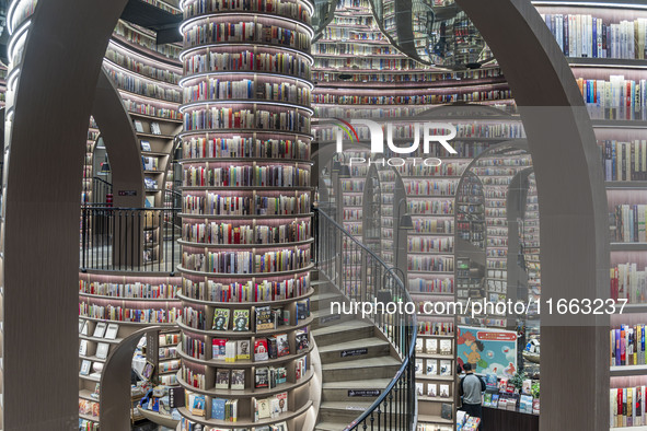 Visitors read books at Zhongshuge Bookstore in Chengdu, China, on October 13, 2024. 