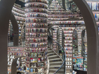 Visitors read books at Zhongshuge Bookstore in Chengdu, China, on October 13, 2024. (