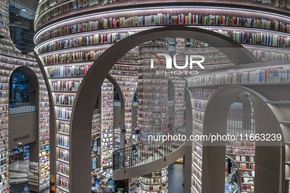 Visitors read books at Zhongshuge Bookstore in Chengdu, China, on October 13, 2024. 