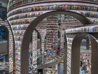 Visitors read books at Zhongshuge Bookstore in Chengdu, China, on October 13, 2024. (