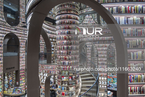 Visitors read books at Zhongshuge Bookstore in Chengdu, China, on October 13, 2024. 