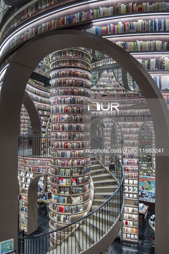 Visitors read books at Zhongshuge Bookstore in Chengdu, China, on October 13, 2024. 