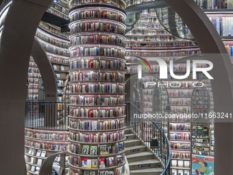 Visitors read books at Zhongshuge Bookstore in Chengdu, China, on October 13, 2024. (