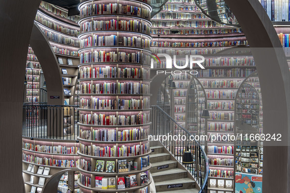 Visitors read books at Zhongshuge Bookstore in Chengdu, China, on October 13, 2024. 