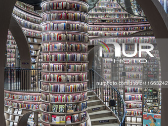 Visitors read books at Zhongshuge Bookstore in Chengdu, China, on October 13, 2024. (