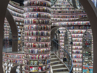 Visitors read books at Zhongshuge Bookstore in Chengdu, China, on October 13, 2024. (