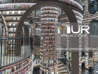 Visitors read books at Zhongshuge Bookstore in Chengdu, China, on October 13, 2024. (