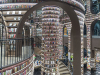 Visitors read books at Zhongshuge Bookstore in Chengdu, China, on October 13, 2024. (