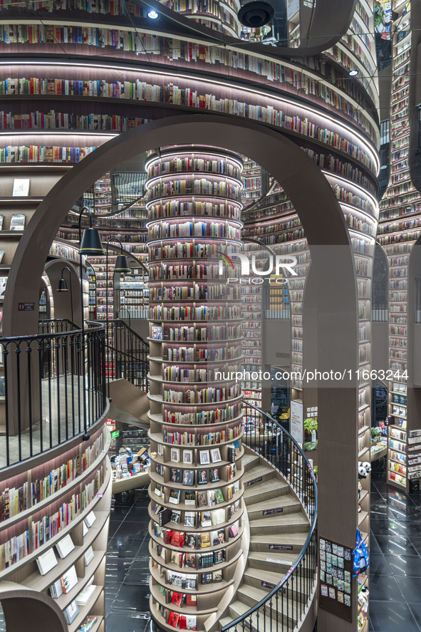 Visitors read books at Zhongshuge Bookstore in Chengdu, China, on October 13, 2024. 