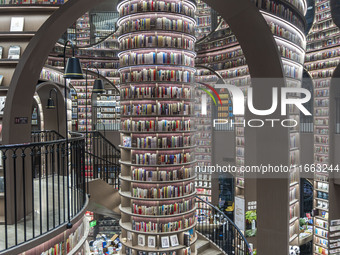 Visitors read books at Zhongshuge Bookstore in Chengdu, China, on October 13, 2024. (