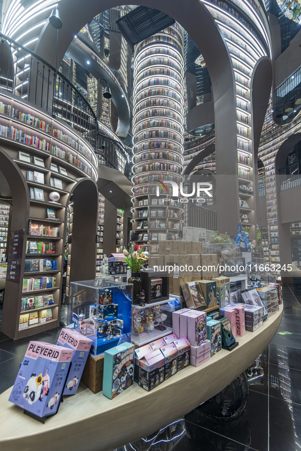 Visitors read books at Zhongshuge Bookstore in Chengdu, China, on October 13, 2024. 