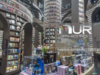 Visitors read books at Zhongshuge Bookstore in Chengdu, China, on October 13, 2024. (