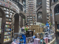 Visitors read books at Zhongshuge Bookstore in Chengdu, China, on October 13, 2024. (