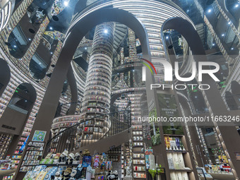 Visitors read books at Zhongshuge Bookstore in Chengdu, China, on October 13, 2024. (