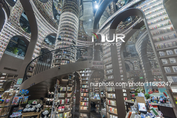 Visitors read books at Zhongshuge Bookstore in Chengdu, China, on October 13, 2024. 