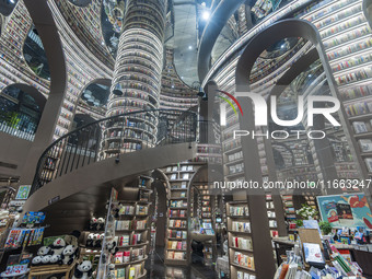 Visitors read books at Zhongshuge Bookstore in Chengdu, China, on October 13, 2024. (