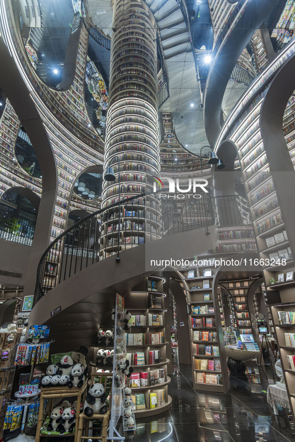 Visitors read books at Zhongshuge Bookstore in Chengdu, China, on October 13, 2024. 