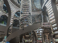 Visitors read books at Zhongshuge Bookstore in Chengdu, China, on October 13, 2024. (