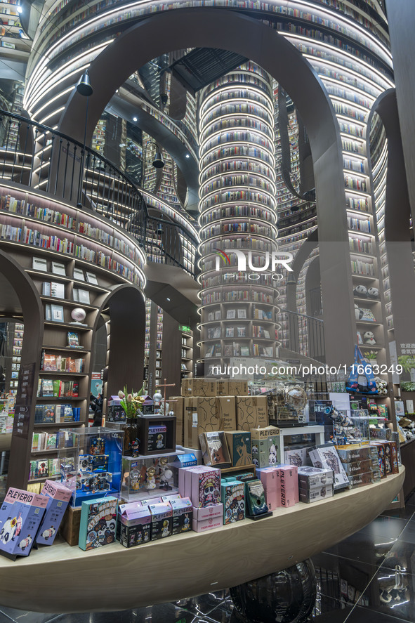 Visitors read books at Zhongshuge Bookstore in Chengdu, China, on October 13, 2024. 