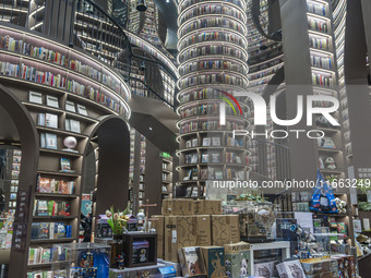 Visitors read books at Zhongshuge Bookstore in Chengdu, China, on October 13, 2024. (