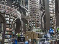 Visitors read books at Zhongshuge Bookstore in Chengdu, China, on October 13, 2024. (