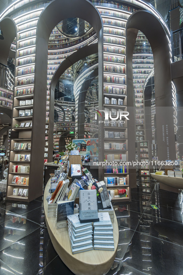 Visitors read books at Zhongshuge Bookstore in Chengdu, China, on October 13, 2024. 