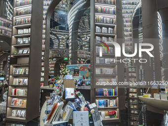 Visitors read books at Zhongshuge Bookstore in Chengdu, China, on October 13, 2024. (