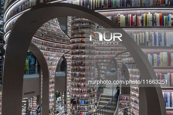 Visitors read books at Zhongshuge Bookstore in Chengdu, China, on October 13, 2024. 