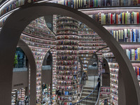 Visitors read books at Zhongshuge Bookstore in Chengdu, China, on October 13, 2024. (