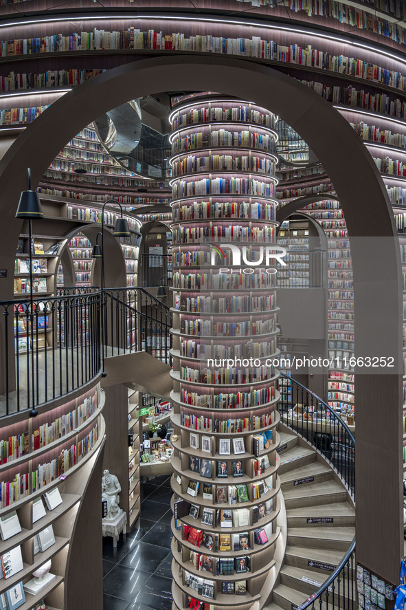 Visitors read books at Zhongshuge Bookstore in Chengdu, China, on October 13, 2024. 