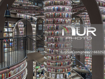 Visitors read books at Zhongshuge Bookstore in Chengdu, China, on October 13, 2024. (