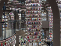 Visitors read books at Zhongshuge Bookstore in Chengdu, China, on October 13, 2024. (