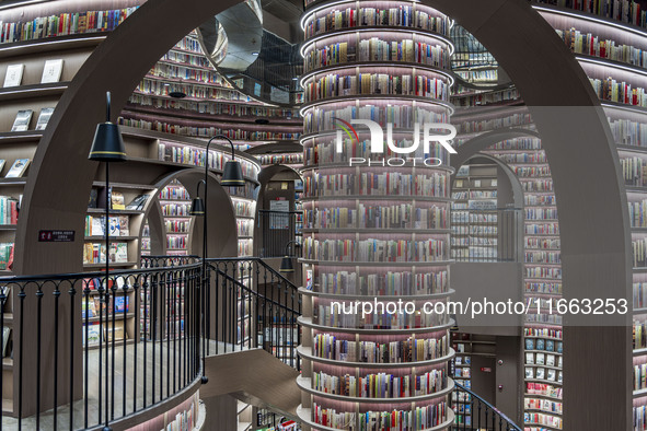 Visitors read books at Zhongshuge Bookstore in Chengdu, China, on October 13, 2024. 