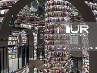 Visitors read books at Zhongshuge Bookstore in Chengdu, China, on October 13, 2024. (