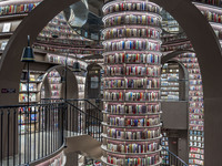 Visitors read books at Zhongshuge Bookstore in Chengdu, China, on October 13, 2024. (