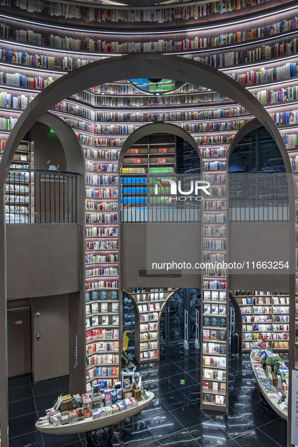 Visitors read books at Zhongshuge Bookstore in Chengdu, China, on October 13, 2024. 