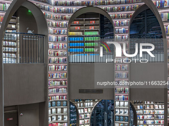 Visitors read books at Zhongshuge Bookstore in Chengdu, China, on October 13, 2024. (