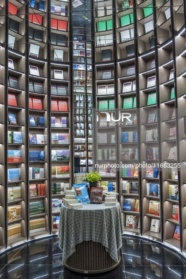 Visitors read books at Zhongshuge Bookstore in Chengdu, China, on October 13, 2024. 