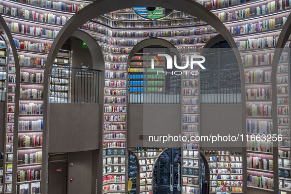 Visitors read books at Zhongshuge Bookstore in Chengdu, China, on October 13, 2024. 