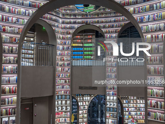 Visitors read books at Zhongshuge Bookstore in Chengdu, China, on October 13, 2024. (