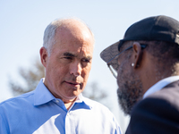 Sen. Bob Casey (D-PA) speaks to a man outside a campaign rally in Philadelphia, Pennsylvania, United States, on October 13, 2024. (